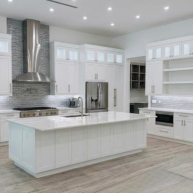 White luxury kitchen with stainless hood